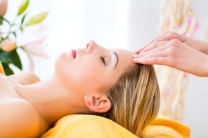 Wellness - woman getting head massage in Spa