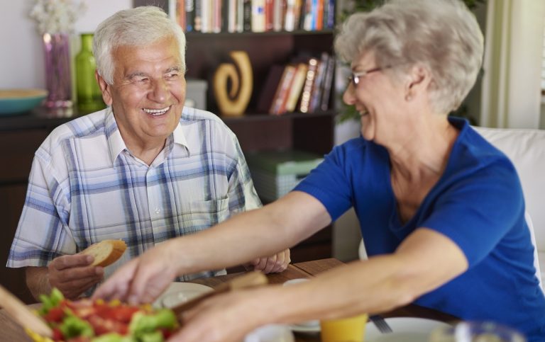 Senior Couple Eating Delicious Breakfast